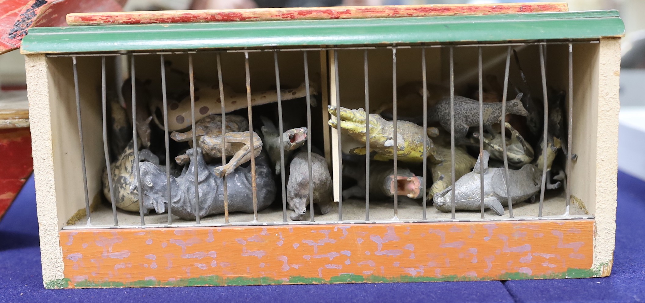 A War Relief Toy Works painted wood Noah's ark, a painted wood toy zoo cage and a quantity of animals